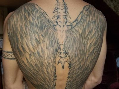 The tattoo has a bird spine and wings.